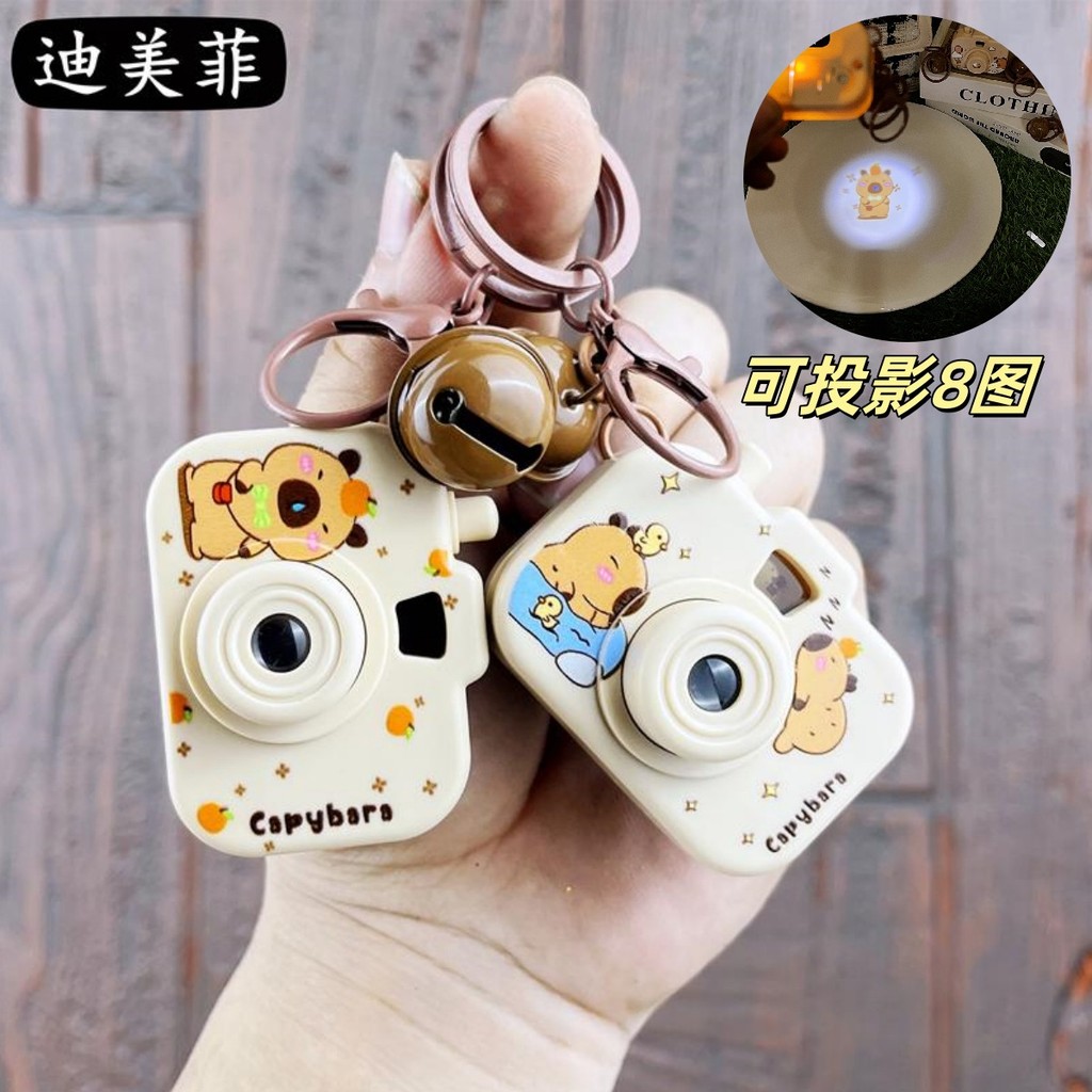 Keychain souvenir Creative Kapibara Capybara Jun Projection Camera Keychain Cute Couple Claw Machine Small Pendant Gift Ready Stock Hot Sale Ready Straw3.10