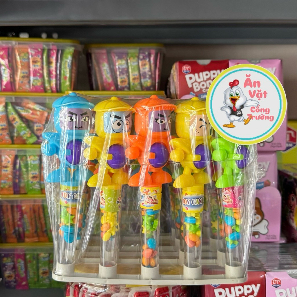 Tray of 20c ball shooting toys with fruit candy for children, ball shooting toys with candy